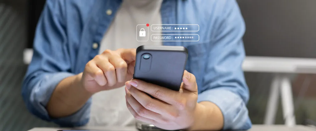 close up man hand use smartphone for accessing privacy profile on account in online system by put username and password for permission security system of technology concept