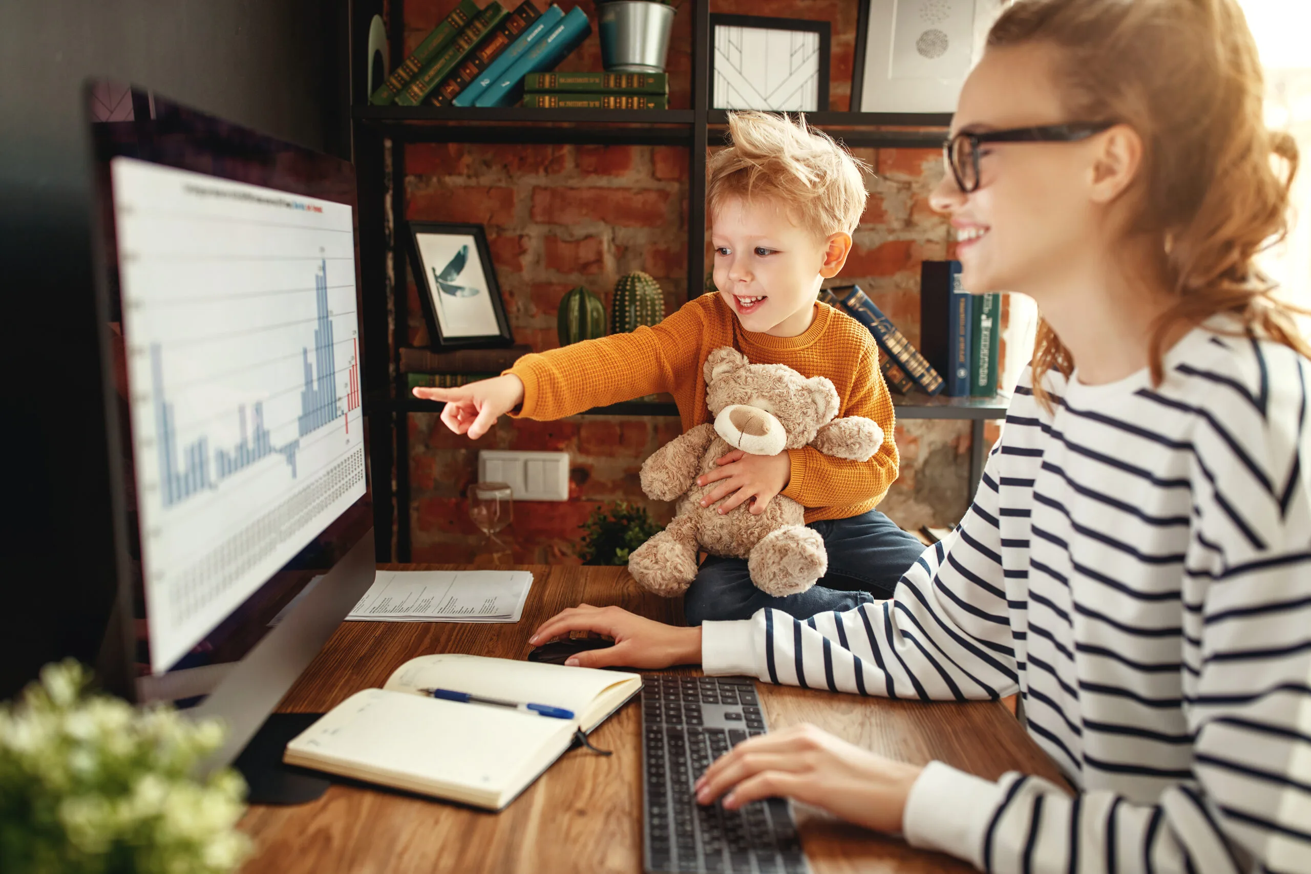 Boy asking mother about data analysis during work